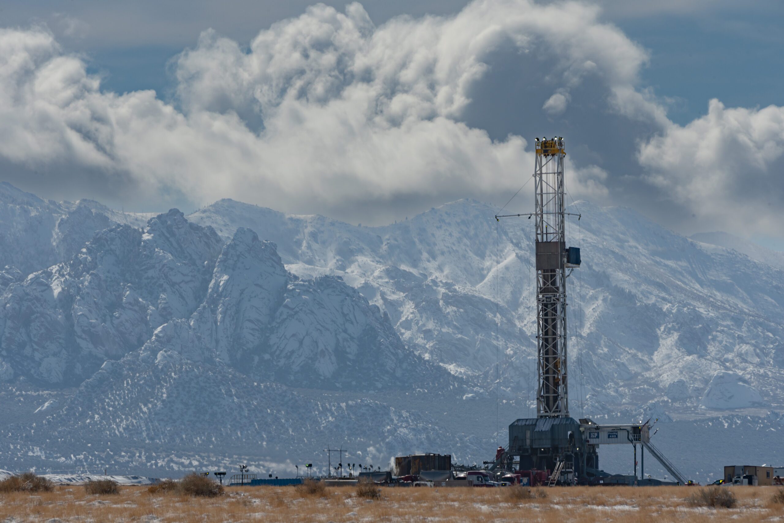 H&P FlexRig 492 drilling geothermal energy in Utah with the snowy Rocky Mountains in the background